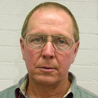 Ed Harbison Man with dark blond receding hair and glasses